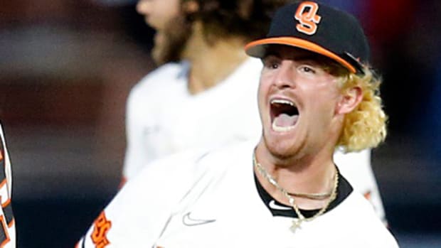 Oklahoma State's Roc Riggio celebrates following a 10-5 win in the NCAA Stillwater Regionals over the Missouri State Bears.